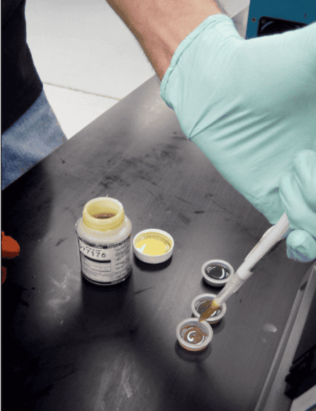 Oil samples being prepared for analysis to monitor contamination and lubricant condition.