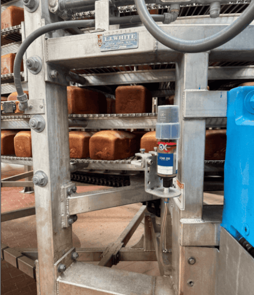 Automated lubrication helps keep a high-volume food production line running reliably.